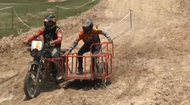 Hilarious motorcycle sidecar race held through thick mud in Thailand