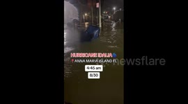 Woman swims through flooded street as Hurricane Idalia hits Florida