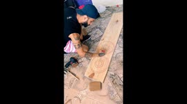 Man does an ingenious DIY to make bear-bottle and glass stand out of wood