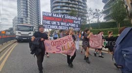 Anti-war protesters block roads on the first day of DSEI arms fair at London's ExCel centre