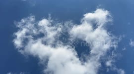 This is a time lapse of white fluffy clouds passing overhead after a stormy morning of rain near Edmonton, Alberta