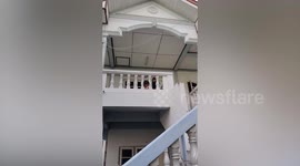 Toddler whose head is stuck in concrete balcony pillars is saved by mum