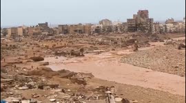 Debris, mud, and vehicles litter the streets of Libyan city devastated by flooding