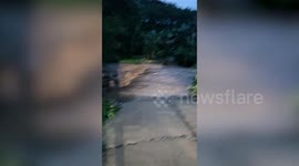 Run-off surges through mountain following monsoon rain in northern Thailand