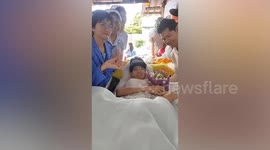 Bedridden cancer patient marries gay partner of 13 years in emotional wedding ceremony in Thailand