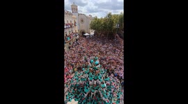 Crowd delighted as performers build 10-storey human town in Barcelona