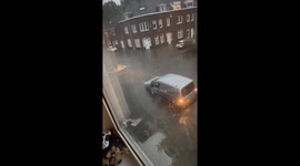 Torrential rain turns Maastricht streets into rivers: cars wading through tire-high floodwaters