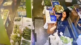 Chinese woman steals pumpkin from market by hiding it under dress