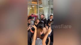 Starstruck fans take selfies with American singer Post Malone in Bangkok