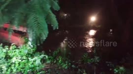 Heavy rains leave village roads submerged in gushing flood in northern Thailand