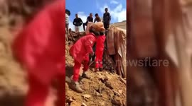 Father Grieves As Child's Body Retrieved From Rubble in Derna, Libya
