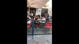Artists Dizzee Rascal and David Haye eating together in Covent Garden