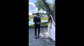 Groom's heart becomes a pool of affection after seeing bride in her wedding dress