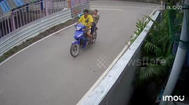 Don't drink and ride! Tipsy pillion passenger tumbles from motorcycle seat