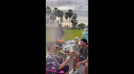 Camping fail as flames from wok splash onto cook's friends
