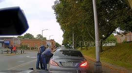 Moment police officer dragged along road by fleeing driver - during routine traffic stop