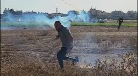 Paramedics treat Palestinian photographer Ashraf Amra