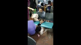 Girl with head stuck between two waiting room chairs rescued in Thailand