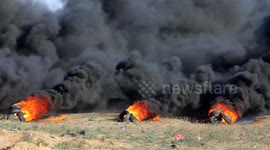 Palestinians demonstrate along the Israel-Gaza border, during a demonstration by the border fence with Israel, east of Gaza City