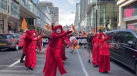 Hundreds of climate activists take part in the 'Global Fight to End Fossil Fuels' march in central London