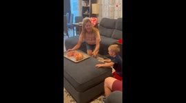 Adorable 3 y/o boy feels delighted as family sings 'Happy Birthday' to him