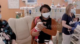 Adorable 'graduation' held for 22-week premature twins who beat the odds to go home