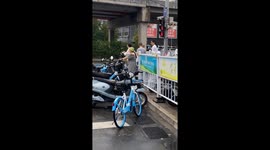 E-bike rider wears watermelon on her head as helmet in China