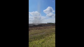 Dust Devil Moves Through Harvested Corn Field