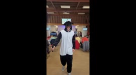 Vicar dancing in a sheep onesie outfit in church as part of the service