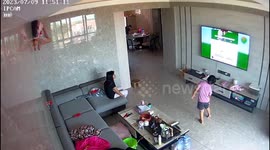 Daring 'Spider-Girl' who watches TV from CEILING goes viral in China