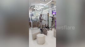 Police wrangle knife-wielding customer rampaging in bank in Thailand