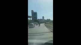Unusual sight: police officer rides broken motorbike on fuel tank in Córdoba, Argentina