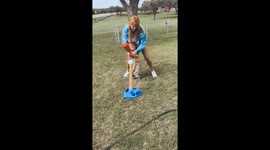Mom sends ball (and her son) FLYING while demonstrating how to swing a baseball bat
