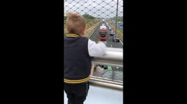 Boy Waves to Truckers