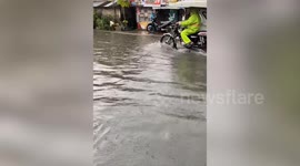 Flood covers road following heavy rain in the Philippines