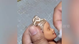 Barbie fan repaints dolls with her own custom features