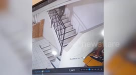 Youngster misses steps but makes a save by clinging to handrail