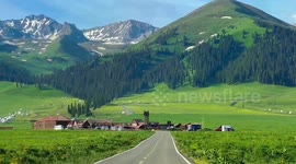 Breathtaking scenery with view of snow-capped mountains greets roadtrippers in China