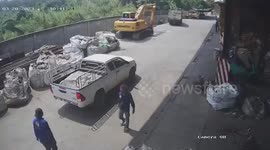Dump truck rolls backwards and crashes on huge sacks of trash