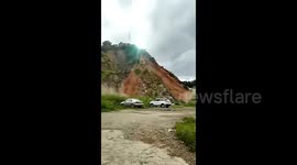 Utility pole topples and ignites amid southern China landslide
