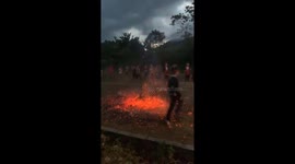 Brave devotees dash barefoot across burning embers during fiery festival in Vietnam