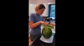 Slicing A Melon With A Melon-Slicer