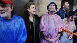Climate protesters block the doors to the Federal Reserve Bank of New York