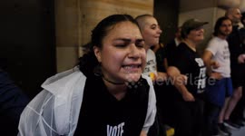 Climate protesters block the doors to the Federal Reserve Bank of New York