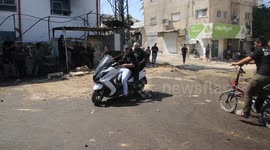 Mourners carry the bodies of three Palestinians killed in an Israeli raid on the Jenin camp for Palestinian refugees in the West Bank