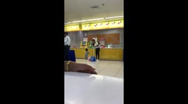 Adorable toddler claps excitedly as mum gives him carton of juice to drink