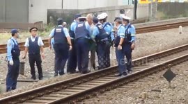 Man walks on train tracks in Japan prompting police chase