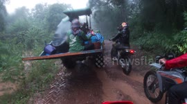 Motorcyclist swept away by flash flood gushing through mountain road in Thailand