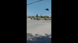 Farmer takes herd of cows on road causing traffic jam in the countryside