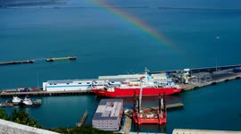Rainbow beams over Bibby Stockholm barge that remains empty